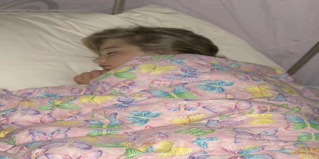 sleeping angel with her DIY weighted blanket